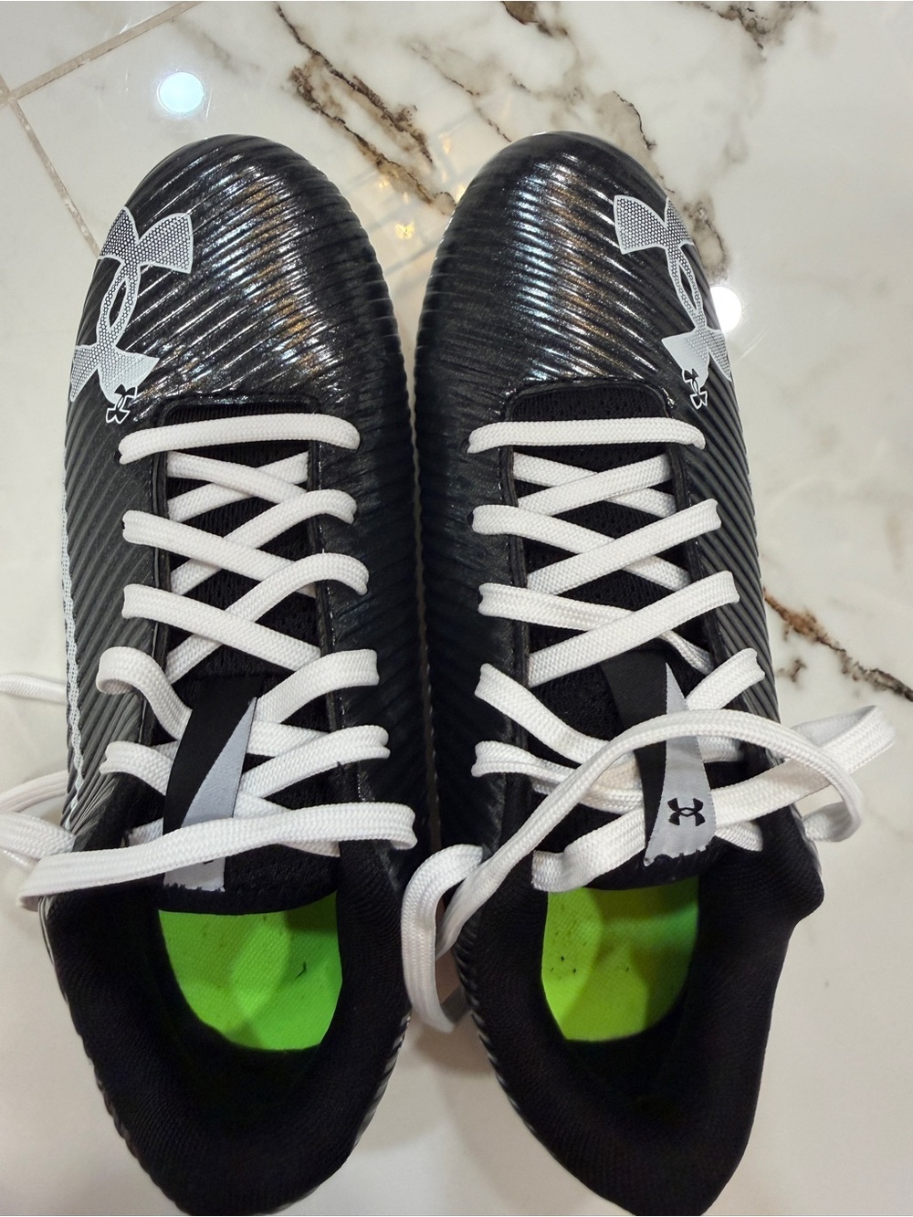 Under Armour Kids' Black Cleats with White Laces- size 4